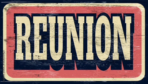 aged and worn reunion sign on wood