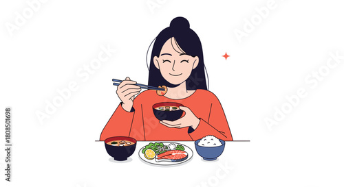 A young woman happily eats a traditional Japanese meal with salmon, rice, and miso soup.