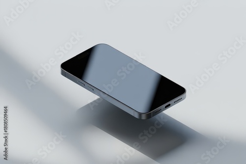 Sleek dark gray smartphone floating on light gray surface