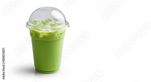 Refreshing green smoothie in a clear plastic cup with lid
