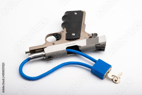 Automatic pistol hand gun  with Locked disarmed and secured on white background , Gun Safety concept
