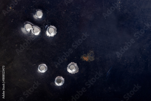 Real bullet holes on old metal , Can be used as a background
