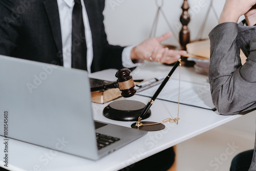 A notary or notary working with contract documents in a courtroom, meeting with clients, and discussing real estate contract documents.