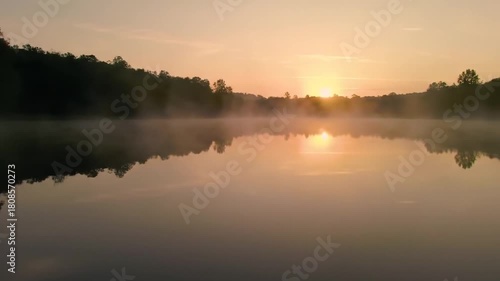 Wallpaper Mural Golden sunrise reflecting on a calm lake with mist rising, evoking peace and tranquility in nature's morning embrace Torontodigital.ca