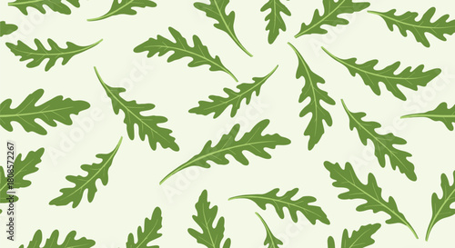 Seamless pattern of green arugula leaves on a light green background.