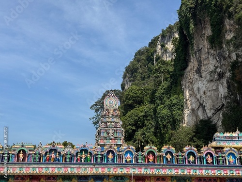 Photography Colorful Hindu Temple Gopuram at the Base of the Dramatic Limestone Cliff of Bat