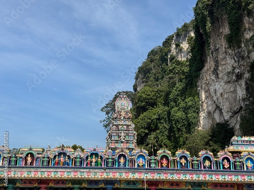 Photography Colorful Hindu Temple Gopuram at the Base of the Dramatic Limestone Cliff of Bat