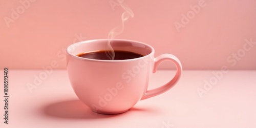A steaming cup of coffee in a pale pink mug sits on a matching pink surface