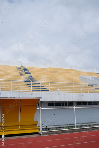 Sunny Outdoor Stadium Grandstand With Team Shelter and Running Track Infrastructure