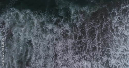 Surging sea waves hitting close-up.