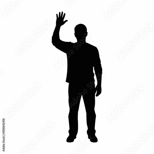 Full body silhouette of a man raising his hand in greeting or asking a question.