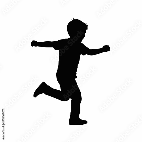 Black silhouette of a young boy running playfully isolated on white.
