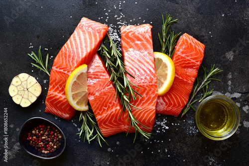 Raw fresh organic trout fillet with ingredients for cooking . Top view with copy space.