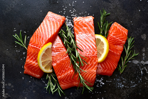 Raw fresh organic trout fillet with ingredients for cooking . Top view with copy space.