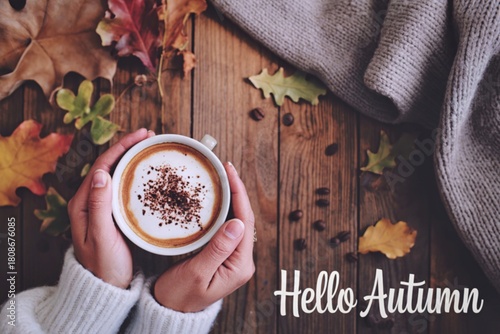 Cozy autumn morning with warm coffee and falling leaves