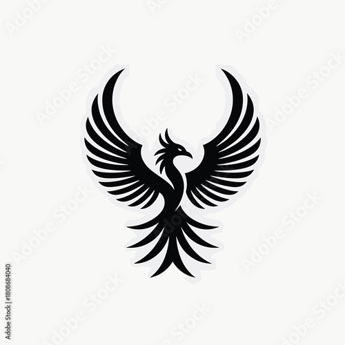 Black silhouette of a mythical phoenix bird with wings spread wide