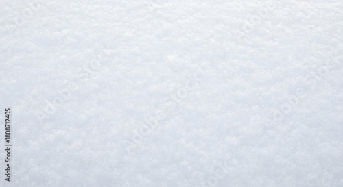 A close-up shot of a snow-covered surface, showcasing the texture and patterns created by the snow crystals.