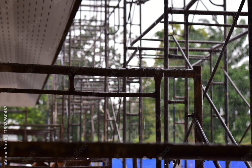 Obraz premium Scaffolding for building improvements, Renovation scaffolding enveloping historical building facade