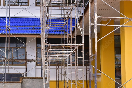 Scaffolding for building improvements, Renovation scaffolding enveloping historical building facade