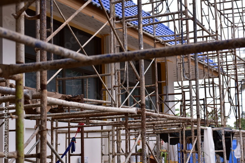 Scaffolding for building improvements, Renovation scaffolding enveloping historical building facade