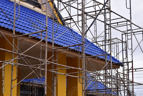 Scaffolding for building improvements, Renovation scaffolding enveloping historical building facade