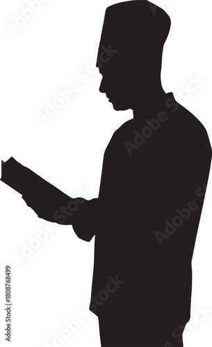 Silhouette of man reading book with traditional hat