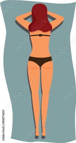 Rear view of woman with long red hair sunbathing lying on blue towel