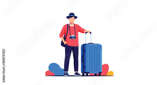 A young man with a camera and a blue suitcase stands ready for a trip.