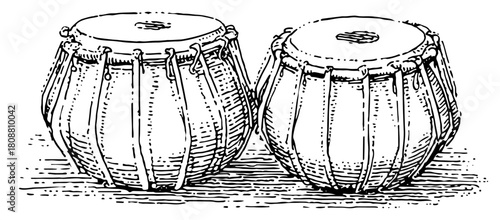 Hand drawn sketch of traditional Indian tabla drums percussion instrument in vintage engraving style