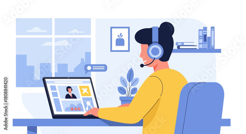 A person wearing a headset attends a video conference call using a laptop at home.