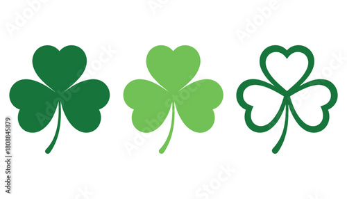 Three green shamrocks in different shades and styles on a white background clover three leaf clover