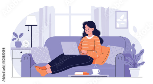 A young woman comfortably works on her laptop from a cozy living room sofa, enjoying a warm beverage and relaxed home office setup.