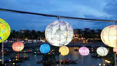 Asia, Vietnam , Hoi An, the city of lanterns, a UNESCO World Heritage Site . the traditional navigation with colored lanterns at night on the Thu Bon River - tourist attraction destination Vietnam 