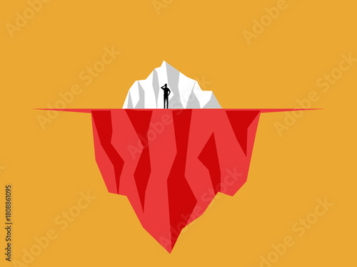 Businessman standing looking at iceberg