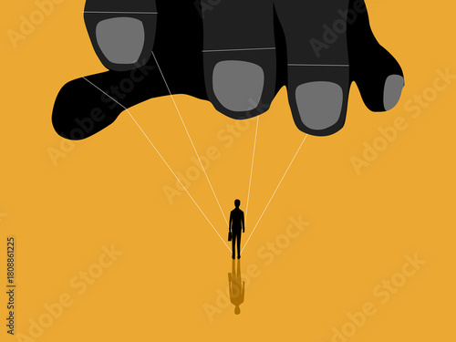 Businessman Being Manipulated by Giant Hand