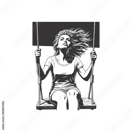 A young woman with flowing hair enjoys the freedom of swinging on a rope swing isolated on