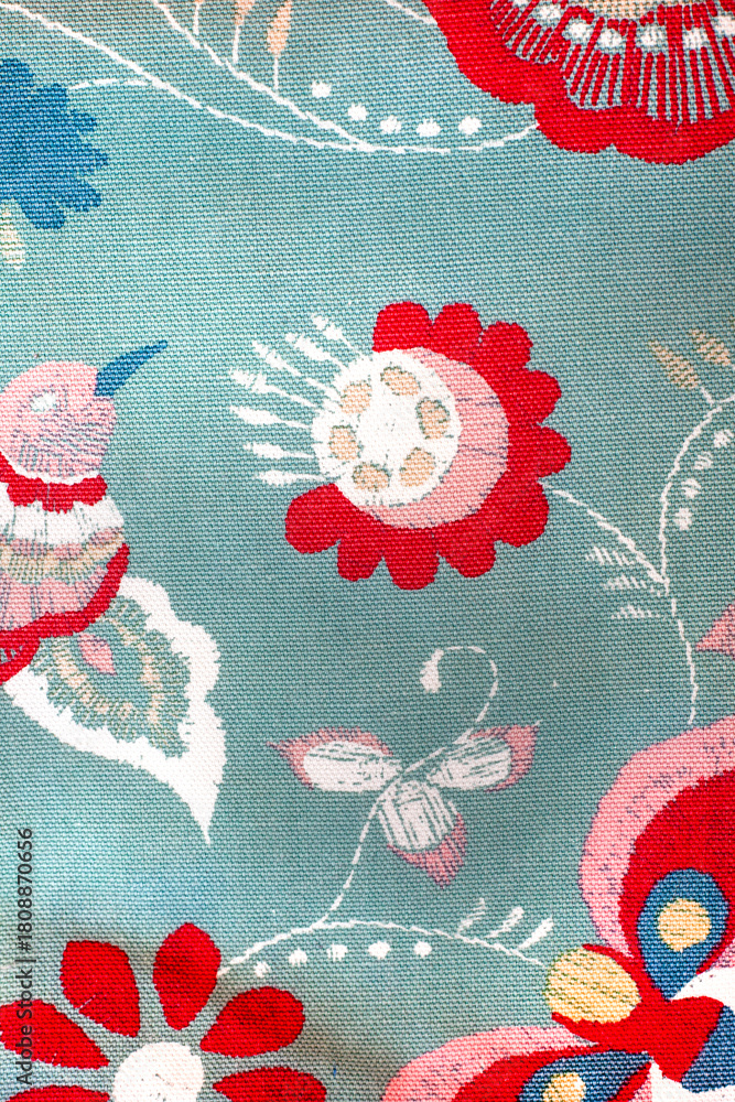 Fototapeta premium Blue and red floral print with a hummingbird and butterflies