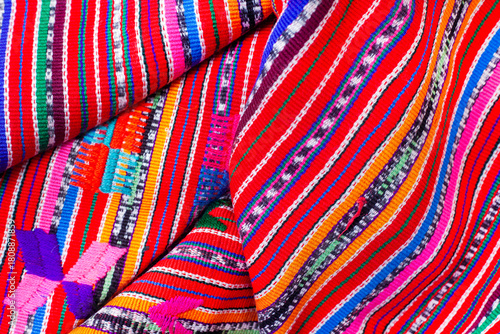 Colorful piece of fabric from Guatemala with a pattern of stripes and dots