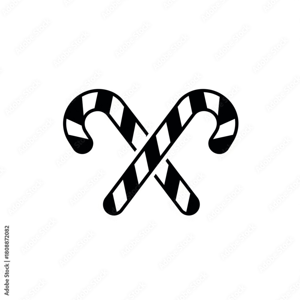 Fototapeta premium Two black and white striped candy canes crossed on white background christmas sweet