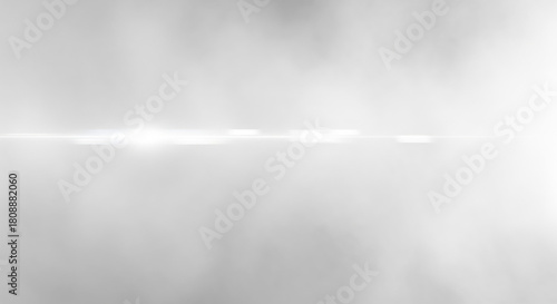 Radiant horizontal light streak on a soft ethereal hazy grey gradient background design