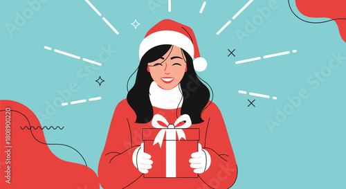 Happy woman in Santa hat holding a Christmas gift with excitement.