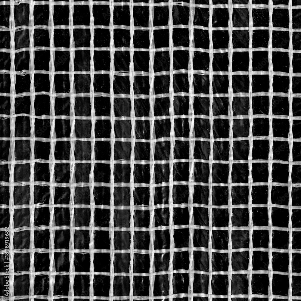 Fototapeta premium The texture of the mesh of white plastic threads