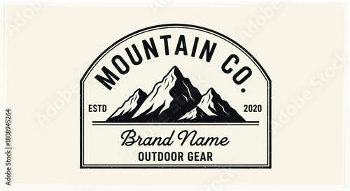 Mountain Co. logo featuring three snow-capped peaks, established in 2020, with "Brand Name Outdoor Gear" text, set against a cream background.