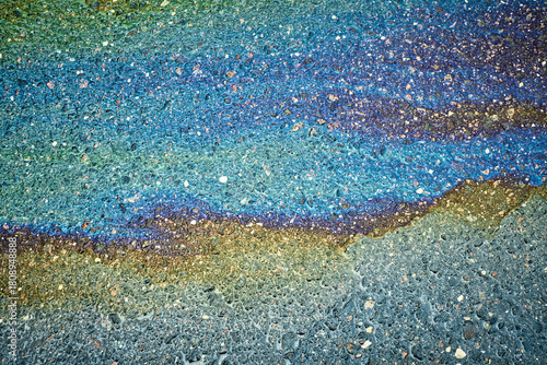 Obraz na plátně Iridescent oil slick on asphalt creating a vibrant rainbow surface