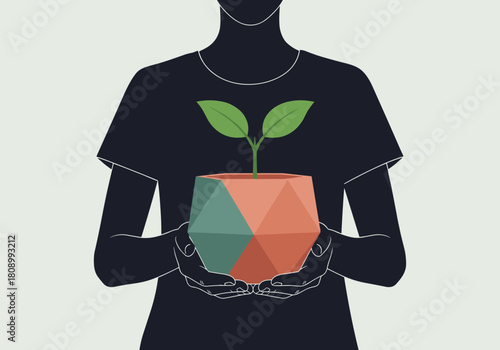 Silhouette of person holding geometric planter with growing plant
