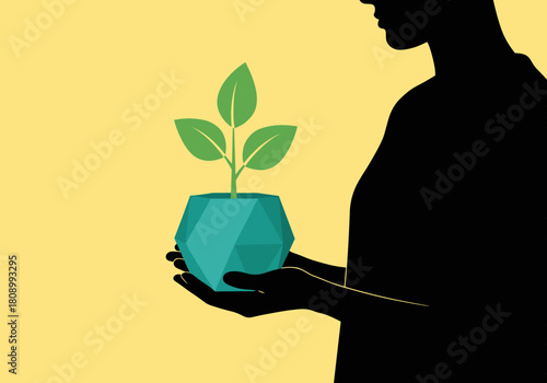 Silhouette of person holding geometric plant pot on yellow background