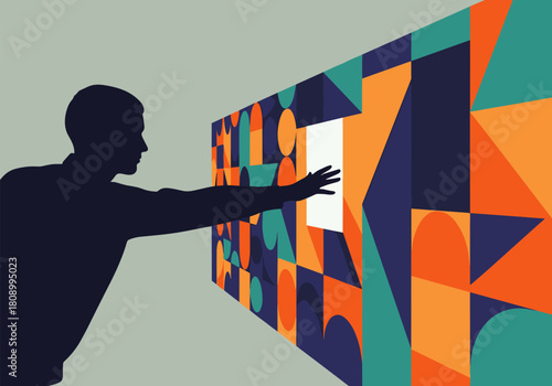 Silhouette man engaging with colorful geometric interactive wall installation