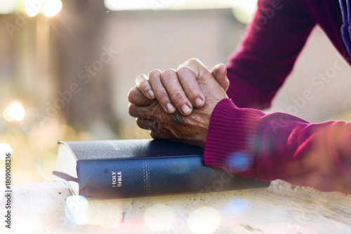 The old woman's closed hand is prayer and thank God.	
