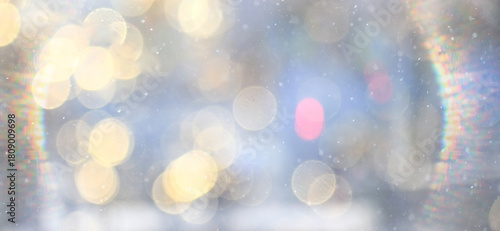Winter abstract background with falling snow and a frame of light, sun glare, festive backdrop
