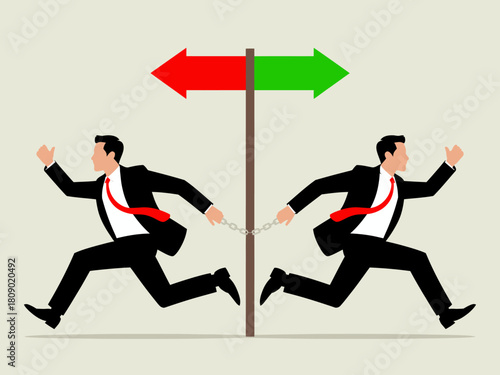 This image illustrates two businessmen running towards opposite directions while chained together, symbolizing conflict and difficult decisions in life and career choices.